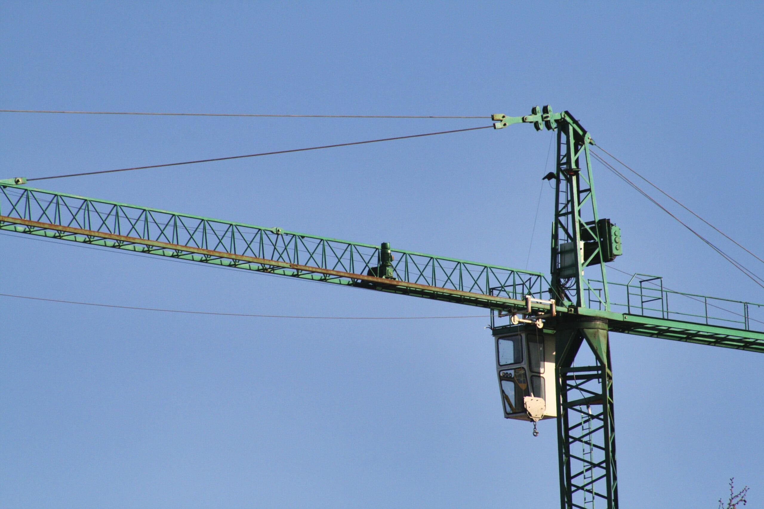 Top of an industrial crane in the sky